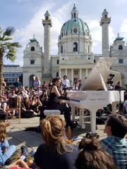 Amanda Palmer charity concert for Open Piano for Refugees at Karlsplatz in Vienna with Karlskirche in the background