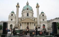 Ben Martin & Band performing at Kunstzone Karlsplatz in front of St. Charles's Church, Vienna, Austria