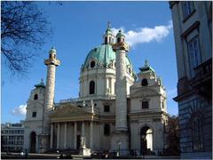 Karlskirche in Vienna with people walking in the foreground