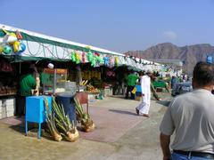 Friday market with various stalls and shoppers