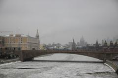 view from Zaryadye Park bridge to Bolshoy Moskvoretsky Bridge in Moscow during winter