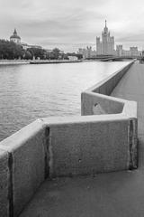 Raushskaya Embankment stone railing with mooring bollard in Moscow