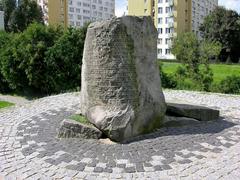 Commemorative stone on top of Anielewicz Mound at 18 Miła Street in Warsaw