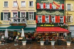 A panoramic view of Baden-Baden showing traditional German buildings, greenery, and hills.