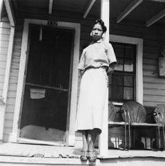 Delois Marie Johnson on the porch of her home in Raleigh, NC, 1957