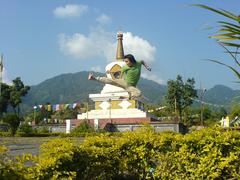 a man practising kungfu in front of the chorten at Itanagar, Arunachal Pradesh