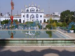 reflection of white gate to Chhota Imambara in water