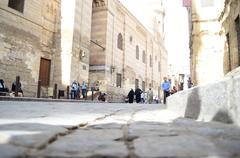 Al Moez Street in Old Cairo featuring historic architecture and bustling street life