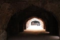 women walking in a dark tunnel