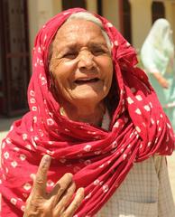 elderly woman voter with indelible ink mark during 2014 Lok Sabha elections in Sonipat