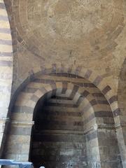 Interior of Bab al-Futuh gate in Cairo with intricate stone architecture