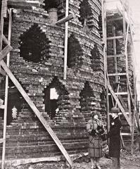 Konstantin Melnikov and his wife standing in front of Melnikov House