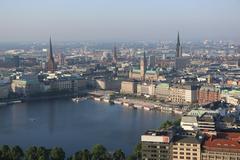 Aerial view of Hamburg featuring Jungfernstieg, Alsterhaus, Hamburg City Hall, St. Nikolai, St. Katharinen, and St. Petri