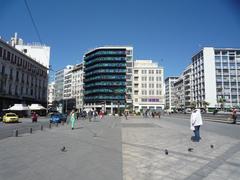 Omonia Square in Athens with pigeons and people co-existing peacefully