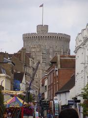 A panoramic view of Windsor Castle in England, showcasing the historic architecture and manicured lawns.