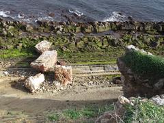 Detached remains of the circular battery walls at the cliffs of Punta de San García.