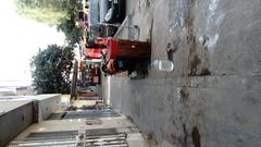 Unsafe buildings on a sidewalk in Jr. Los Herrerillos, Santiago de Surco, Lima, Peru