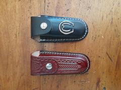 Multiple pocket knife sheaths displayed