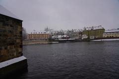 two people canoeing on Vltava River in winter