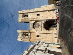 A scenic view of Lisbon with historical buildings and a blue sky