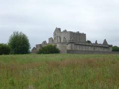 Craigmillar Castle with a circular doocot at the corner nearest to the camera