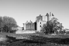 Craigmillar Castle with blue sky and greenery