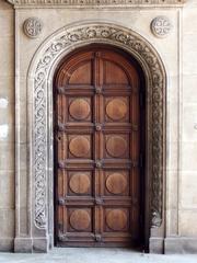 Historical building in Sofia, Bulgaria with architectural details and people walking