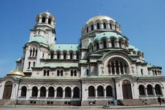 Sofia cityscape with prominent dome buildings and mountains in the background