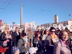 Victory Day parade in Saint Petersburg with crowds of people marching on Nevsky Prospekt