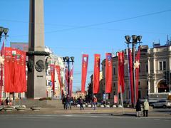 Victory Day parade in Saint Petersburg with people holding photos of veterans on Nevsky Prospekt