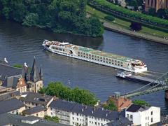 Passenger ship and cargo ship on the Main River near Alte Brücke in Frankfurt