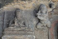 Sculpture of Buddha and Deva in Aurangabad Caves