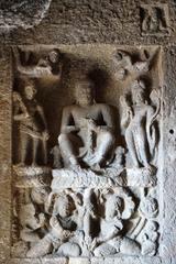 Buddha on lotus supported by Naga statues in Aurangabad Caves