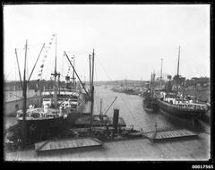 numerous vessels moored at Woolloomooloo wharf