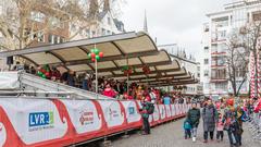 Karneval in Köln with festive crowds and tribunes at Alter Markt