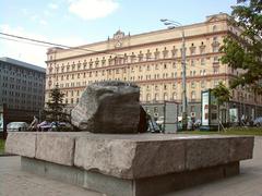 Lubyanka Square in Moscow with stone monument for victims of repression and Lubyanka Building in background