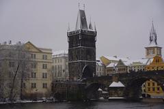 Winter landscape near the Vltava River with a tour bus on a snowy path