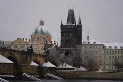 kayakers paddling on the Vltava River in winter