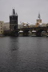 male paddleboarder on the Vltava River in winter