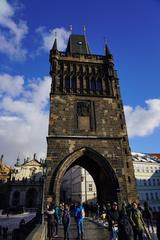 Charles Bridge in Prague under a cloudy sky