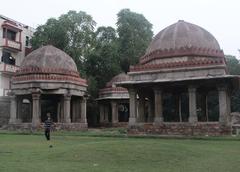 A kid playing badminton in the Tughlaq tombs complex