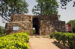 Hauz Khas Fort ruins with lush green surroundings