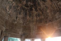 calligraphy incised in the plaster of the roof of the assembly hall