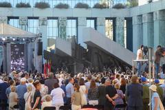 crowd assembled at Warsaw Uprising Memorial during 75th anniversary