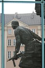 Memorial in Warsaw with reflection on window for Remembrance Day