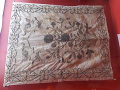 19th-century velvet brocade with silver thread and floral designs at Bapu Museum