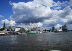 View of the Elbphilharmonie, seen from the harbor tour in front of the St. Pauli Piers, with the Rickmer Rickmers museum ship on the Norderelbe river in Hamburg.