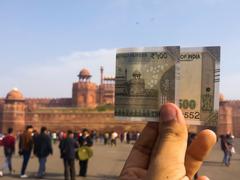 Forced perspective of Red Fort with 500 Rupee note in the foreground