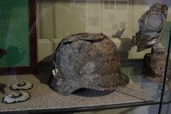 old rusty helmet on ground