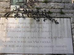 Monument to Dante Alighieri with a quote from the Divine Comedy